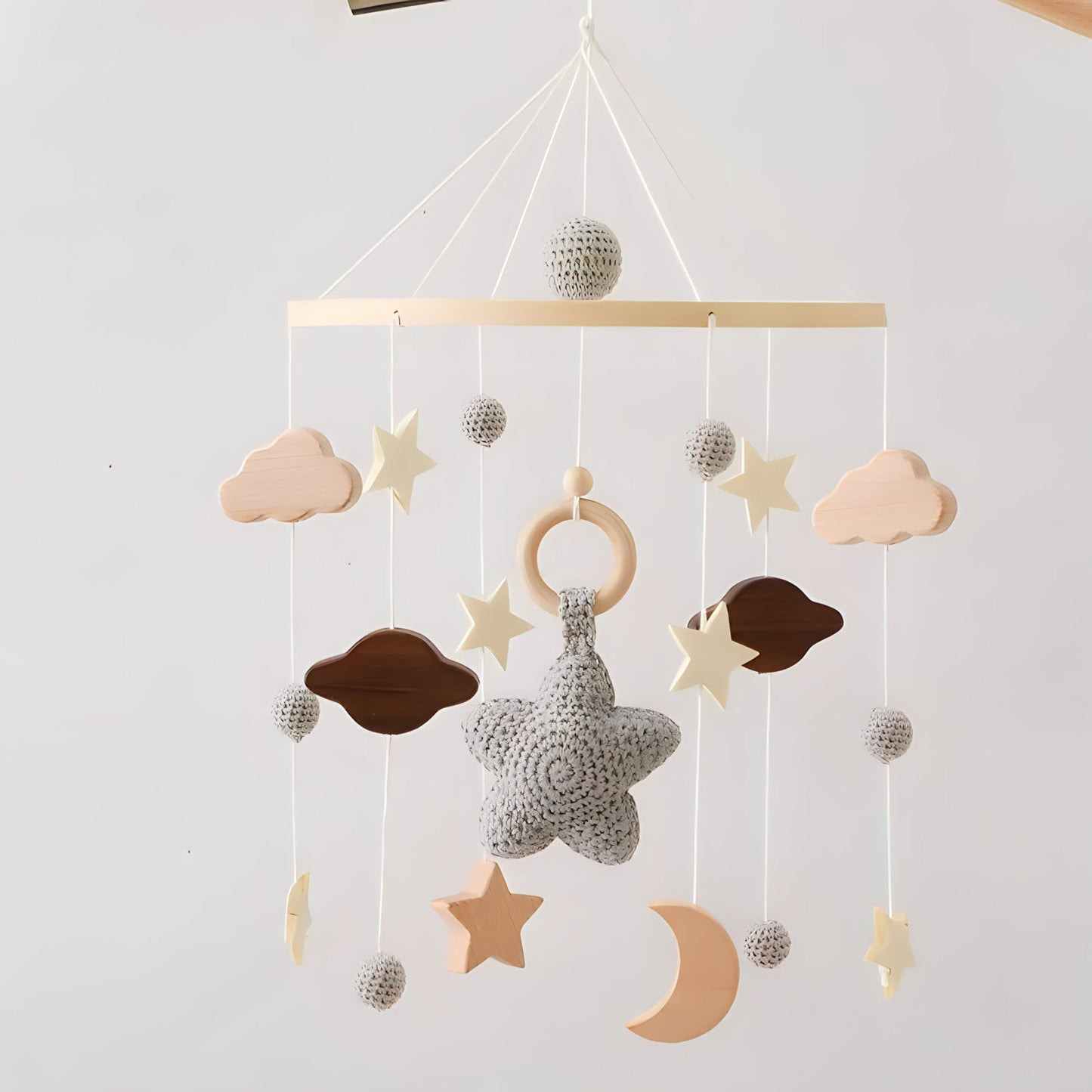 Wooden mobile hanging toys by Petite Pioneers, featuring colorful, handcrafted designs for nursery decoration and entertainment.