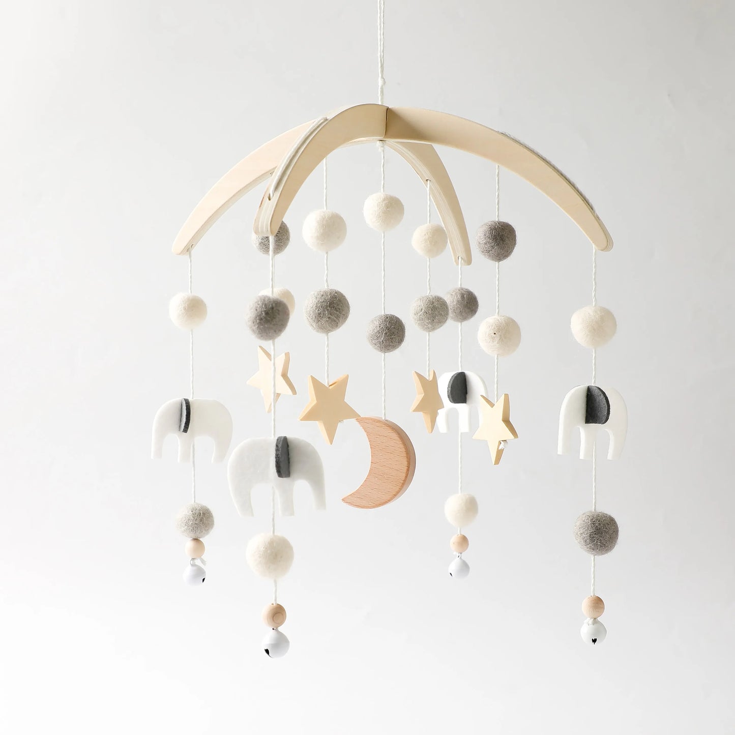 Wooden mobile hanging toys by Petite Pioneers, featuring colorful painted animals and shapes for nursery decor.