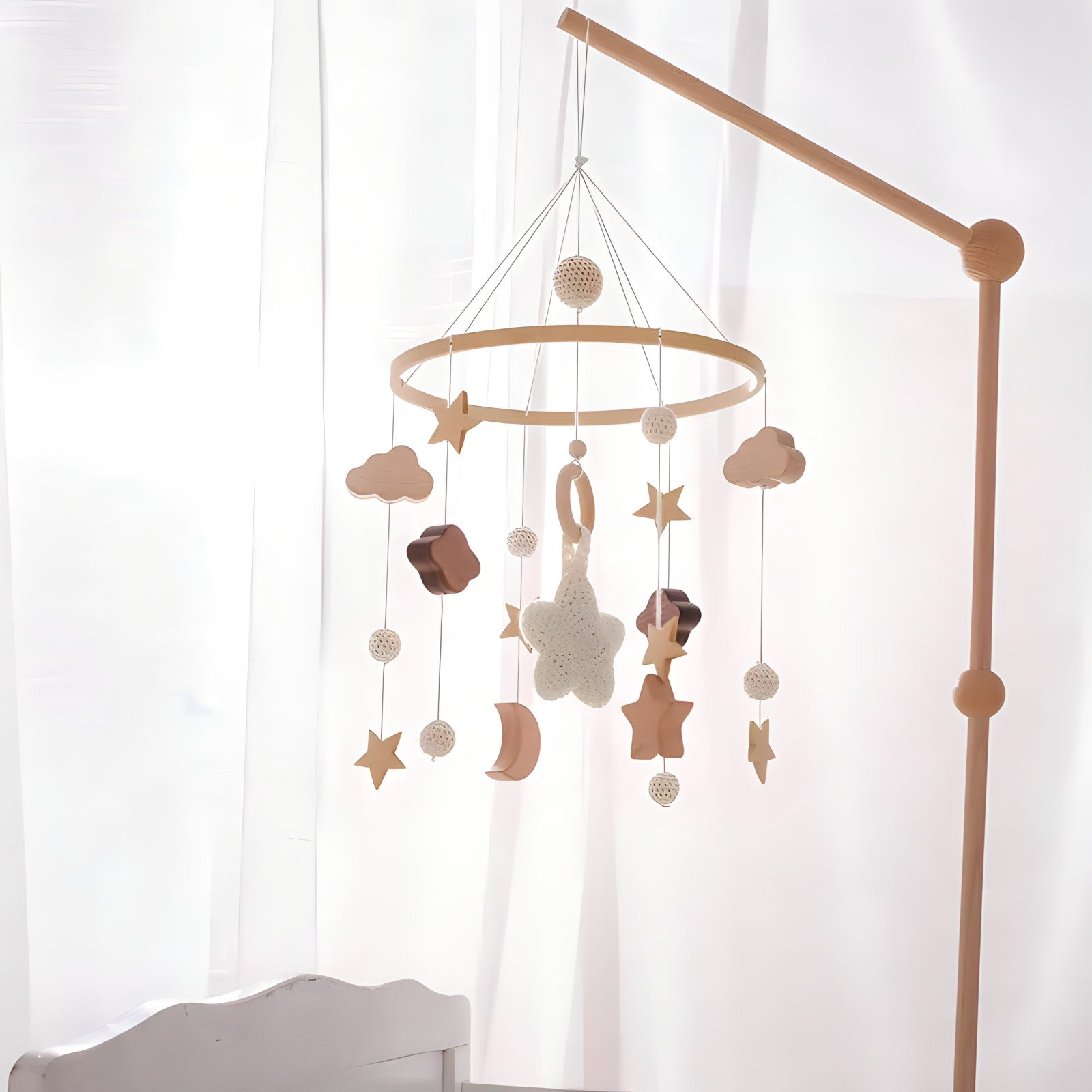 Wooden mobile hanging toys by Petite Pioneers, colorful hand-crafted toys for baby crib decor and sensory development.