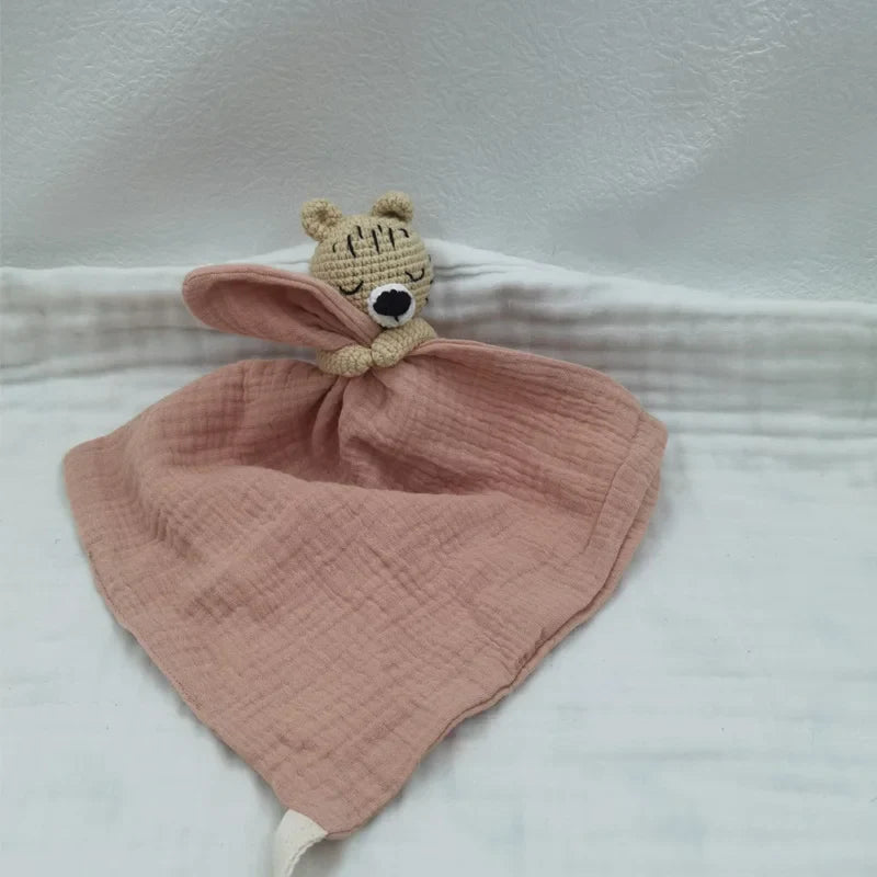 Baby bib with sleeping animal rattle from Petite Pioneers, featuring soft fabric and adorable animal designs for babies.