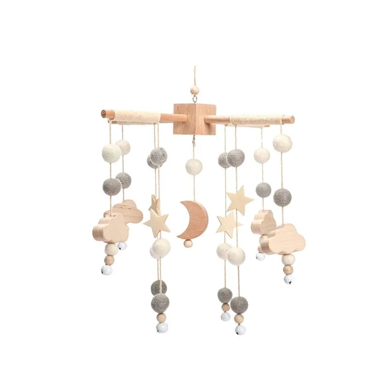 Wooden mobile hanging toys by Petite Pioneers featuring colorful, handcrafted wooden animals and shapes for baby crib decorations.