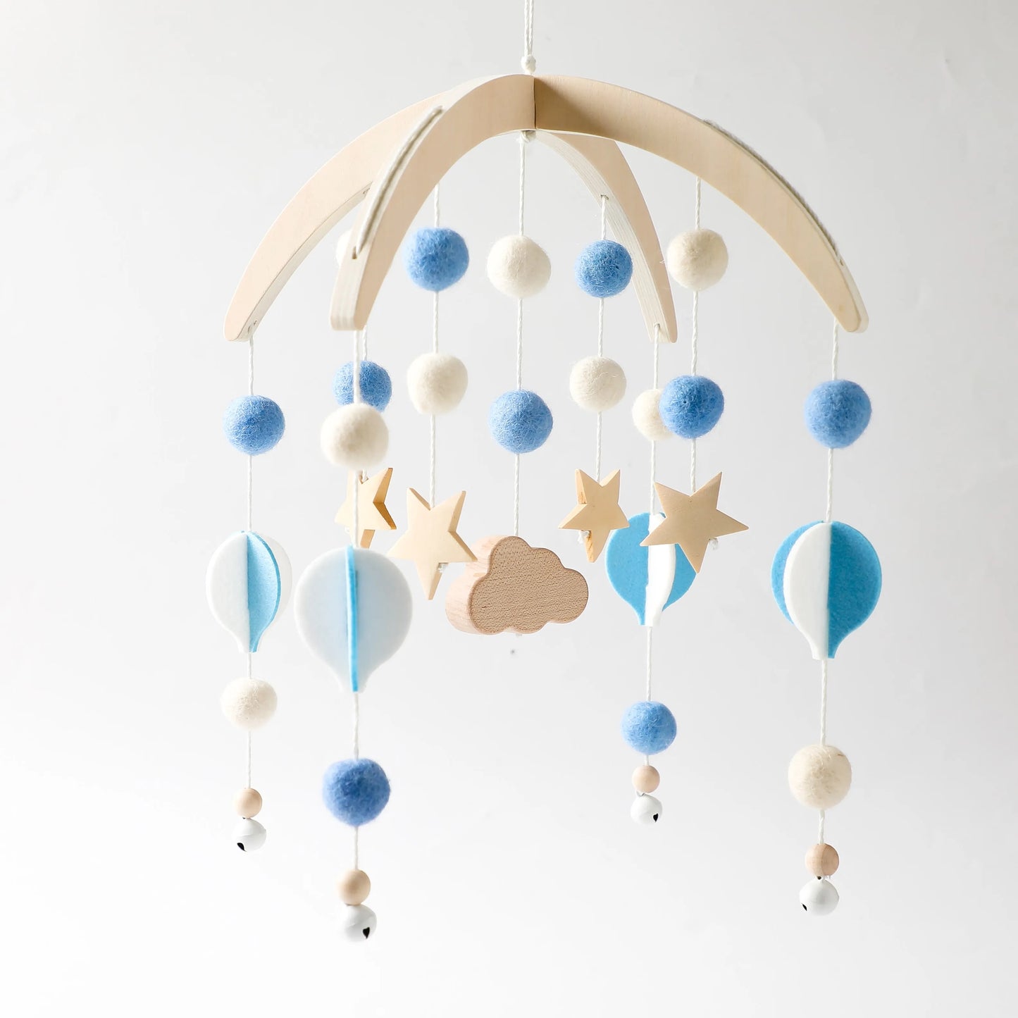 Wooden mobile hanging toys by Petite Pioneers, featuring colorful, handcrafted baby crib decor with natural wood finish.