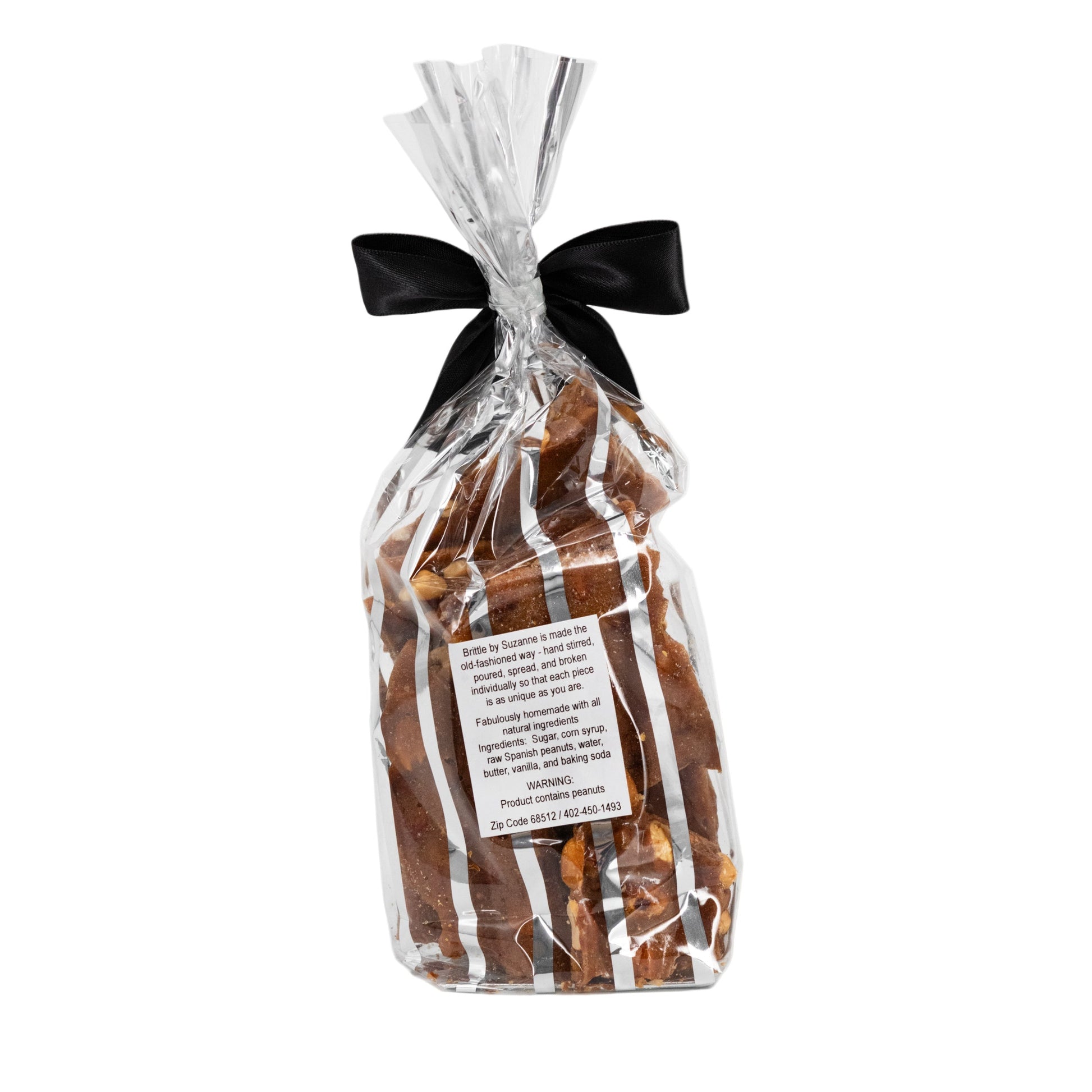 Homemade peanut brittle in an 8 oz bag, featuring golden caramelized peanuts and crunchy texture from Sweets by Suzanne.