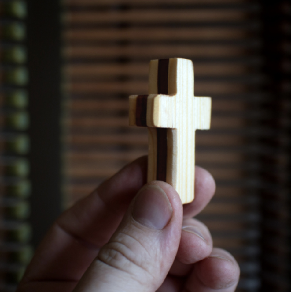 Handmade wooden pocket crosses by Dennehey Design Co. featuring natural wood finish and compact size for personal faith.
