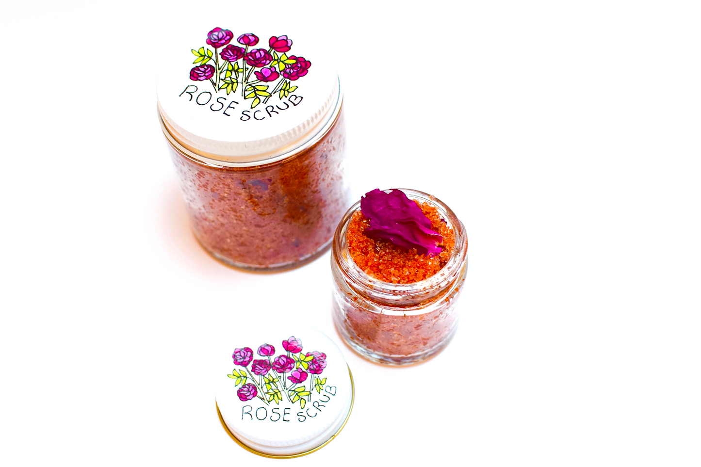 Plant Makeup Beach Rose Scrub in a jar with natural rose and exfoliating ingredients, showcasing a textured surface and botanical packaging.