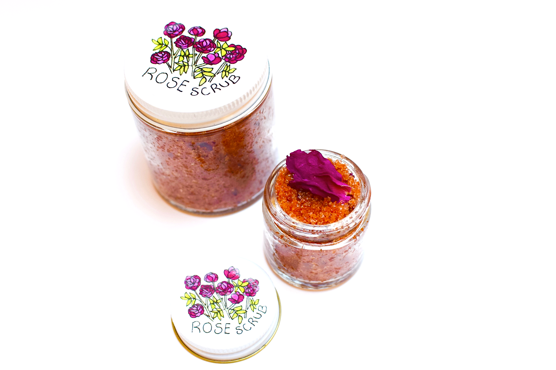 Plant Makeup Beach Rose Scrub in a jar with natural rose and exfoliating ingredients, showcasing a textured surface and botanical packaging.