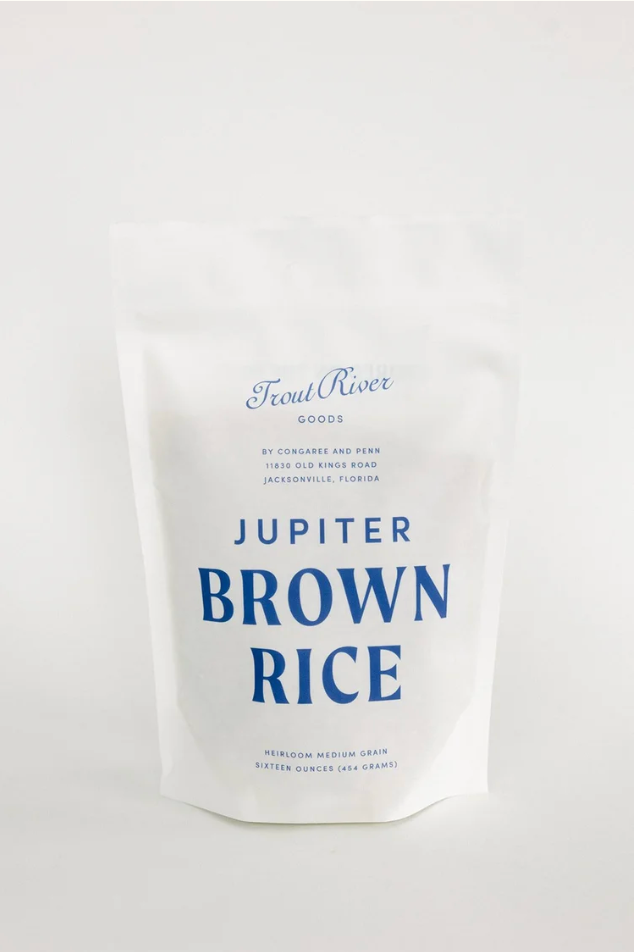 Screenshot of Congaree and Penn Jupiter Brown Rice grains in a clear container, showcasing the light brown rice texture.