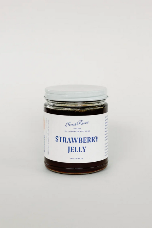 Congaree and Penn strawberry jelly preserves in a jar with a shiny, red, and textured appearance perfect for spreading on bread.