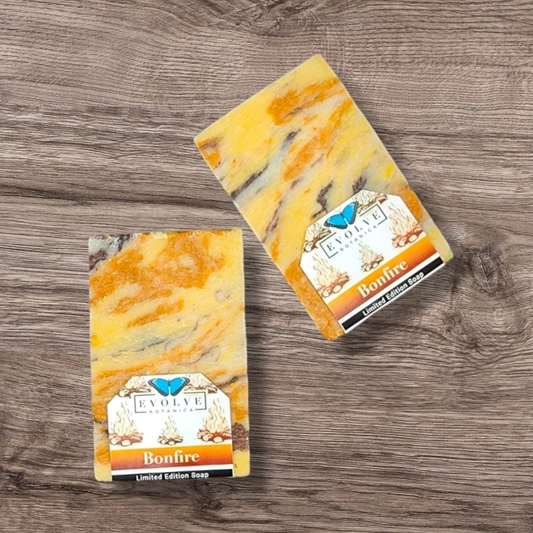 Evolve Botanica Bonfire Christmas seasonal soap with festive firewood and cinnamon scent, decorated with holiday-themed elements.