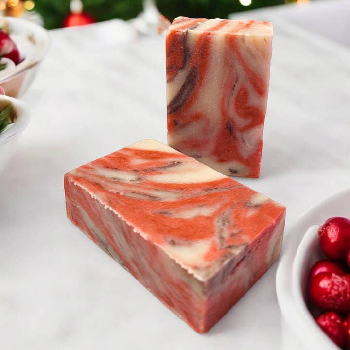 Evolve Botanica Cranberry Woods seasonal soap with festive red and green packaging, featuring cranberry and woodland scents.