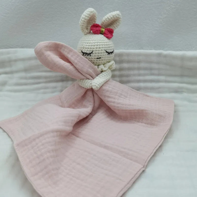 Baby bib with sleeping animals and rattle by Petite Pioneers, featuring soft fabric and cute animal designs for infants.