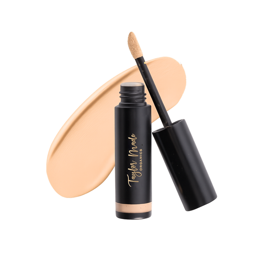 Taylor Made Organics liquid organic concealer with a smooth, creamy texture, perfect for natural coverage and multitasking use.