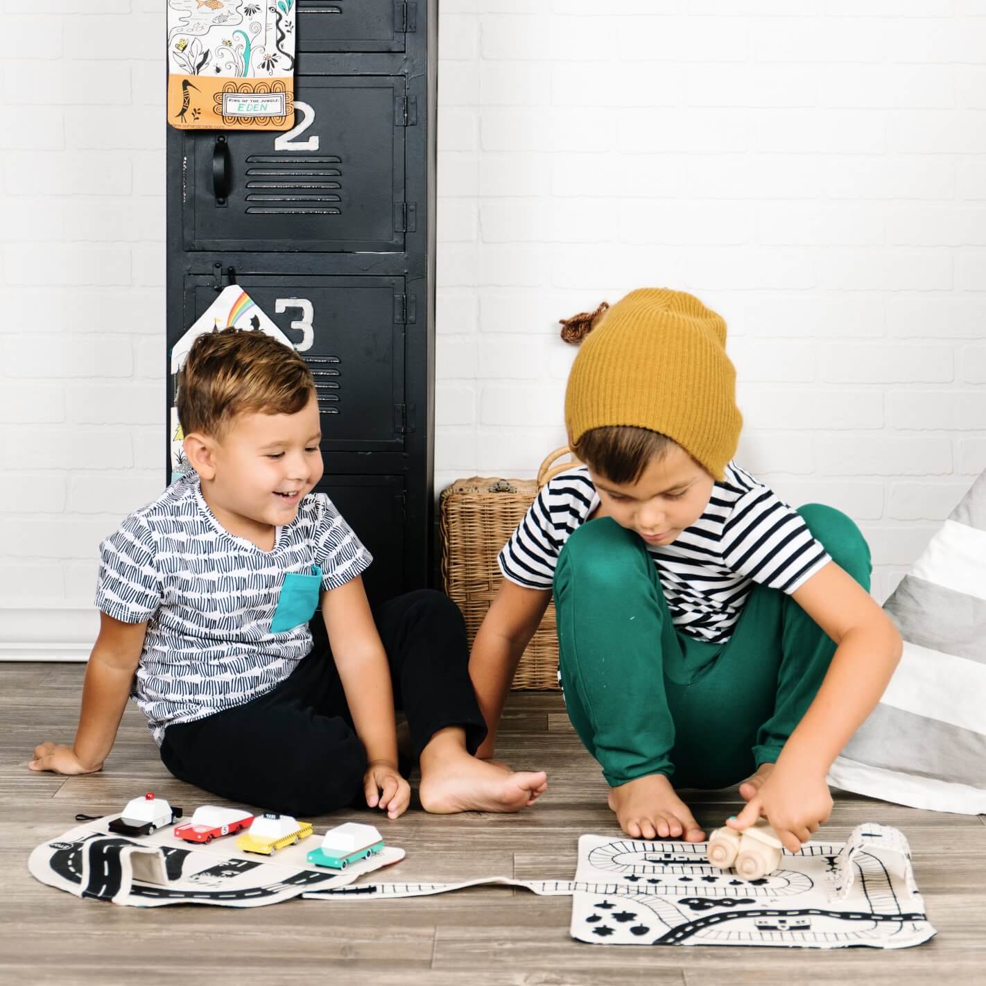 Colorful toddler train playmat with portable track design on a soft fabric surface, perfect for travel and active play.