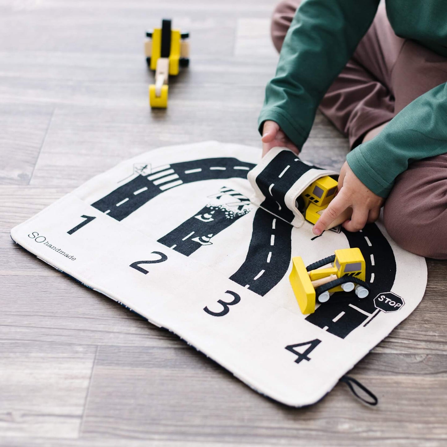 Colorful car playmat by So Handmade Shop, featuring roads and vehicles, designed for easy travel and active play for children.