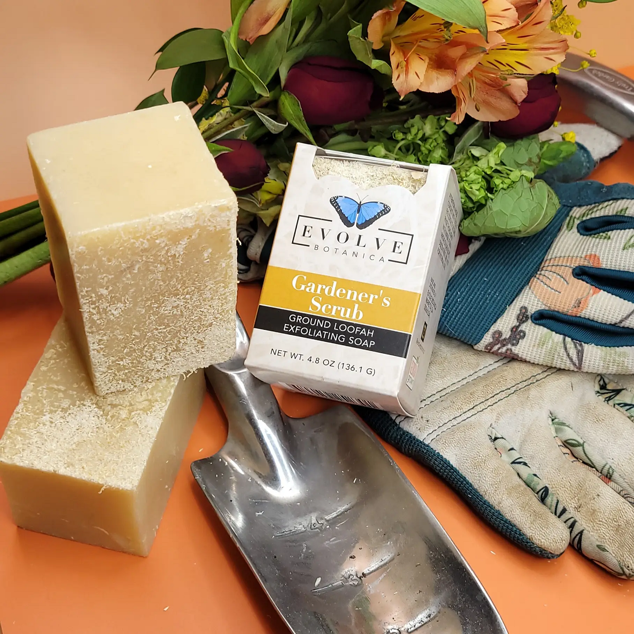 Evolve Botanica Gardener's Specialty Soap with natural ingredients, shown in a rustic soap bar with botanical elements.