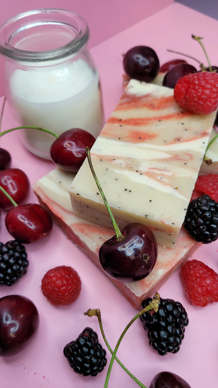 Evolve Botanica Berry Vanilla goat milk soap bar with floral and berry scents, showing its smooth, rectangular shape and natural packaging.