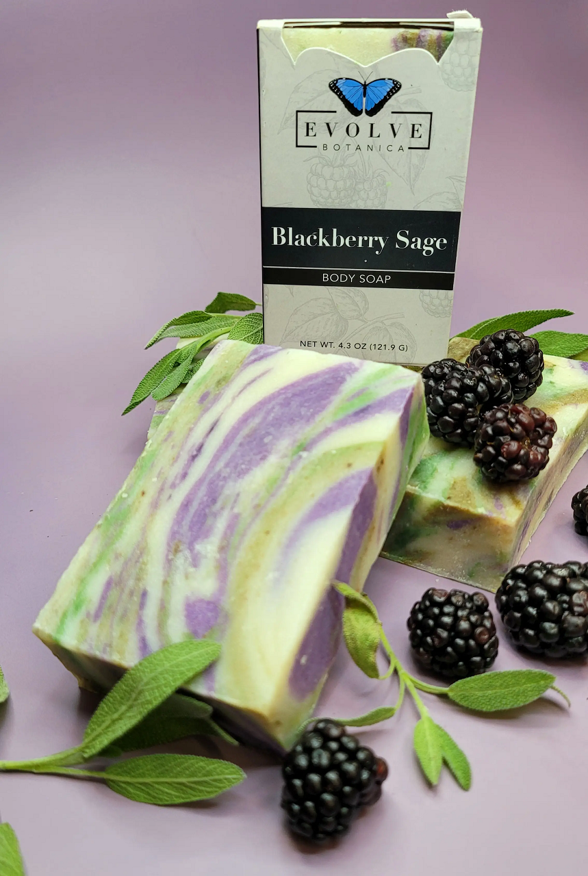 Evolve Botanica Blackberry Sage standard soap bar with blackberries, sage leaves, and natural ingredients, showing the soap's textured surface.