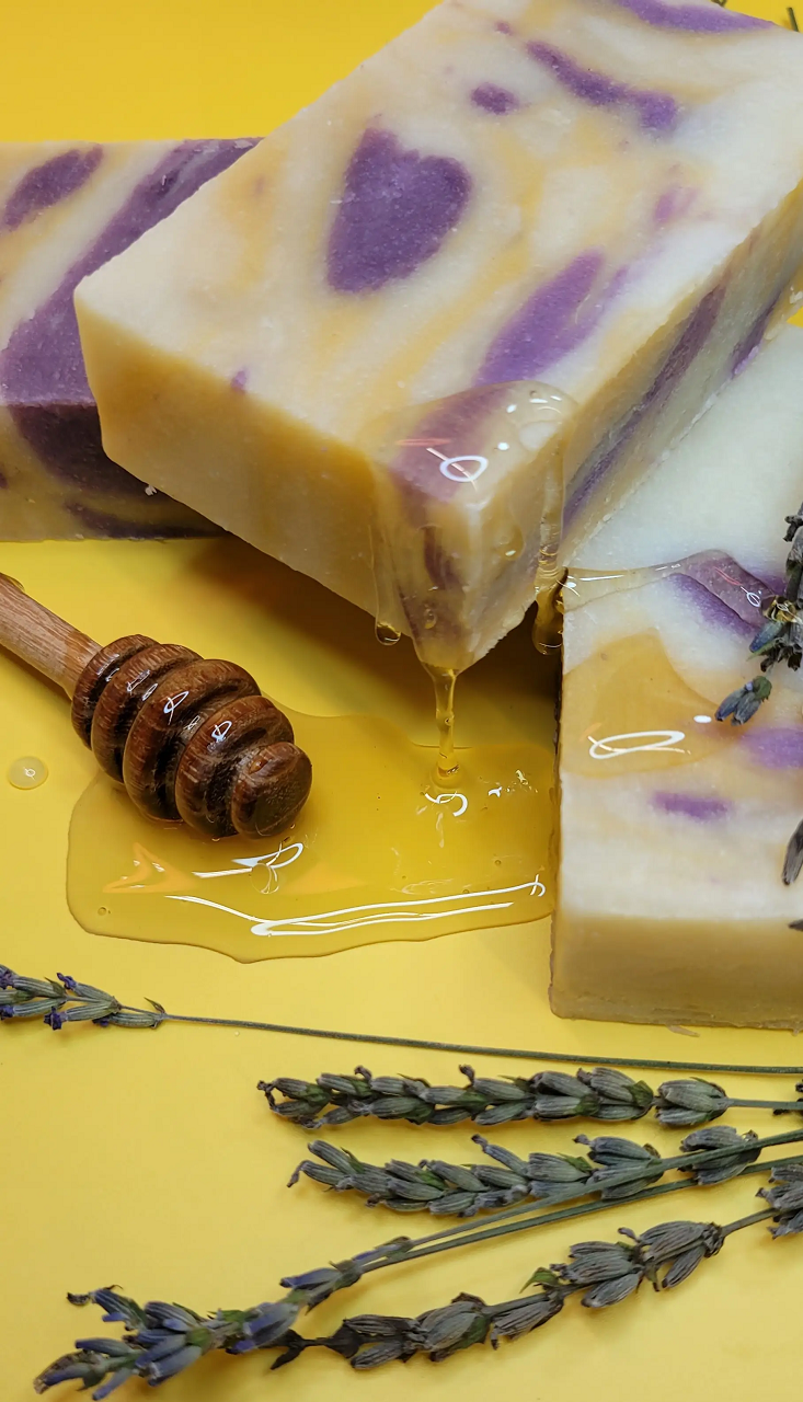 Bar of Evolve Botanica lavender and honey scented standard soap with floral and honey accents, showcasing a natural soap bar.