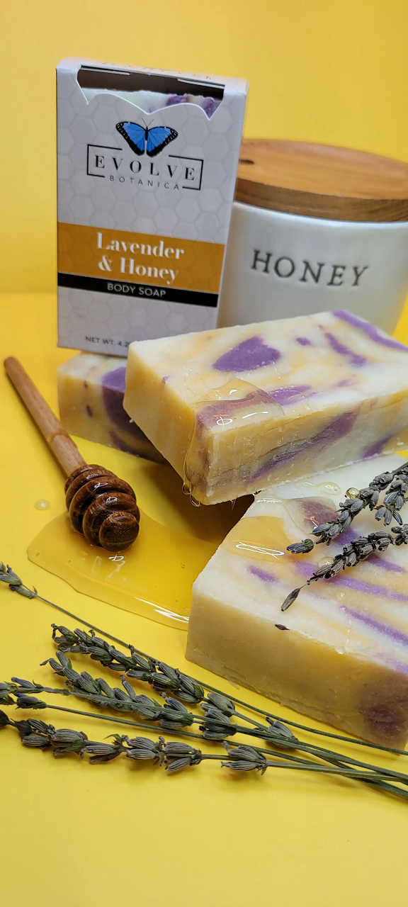 Lavender and honey scented Evolve Botanica standard soap bar with floral lavender flowers and honey drizzles visible.