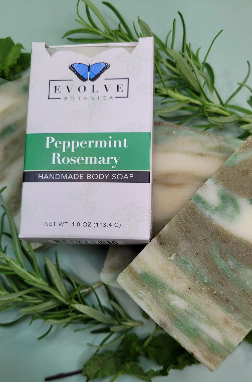 Evolve Botanica peppermint rosemary standard soap bar with fresh herbs and natural ingredients, showing a rustic soap design.