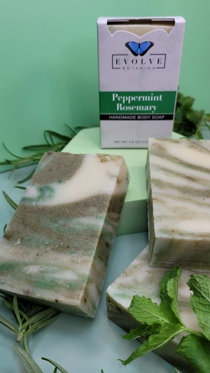 Evolve Botanica peppermint rosemary standard soap bar with fresh herbal scent and natural ingredients, shown in a close-up image.