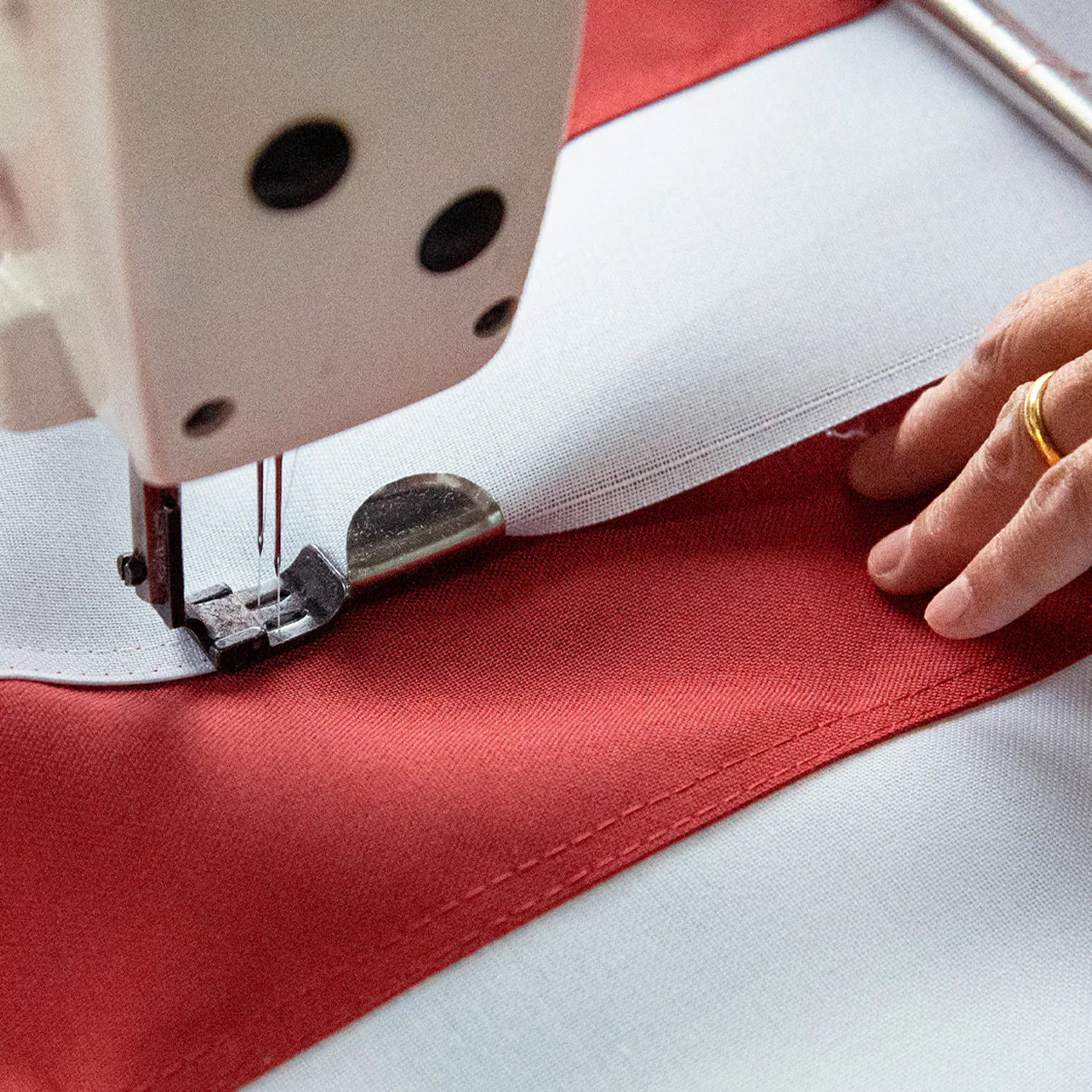 American flag made of durable polyester by Flagman of America, featuring detailed stitching and vibrant colors.