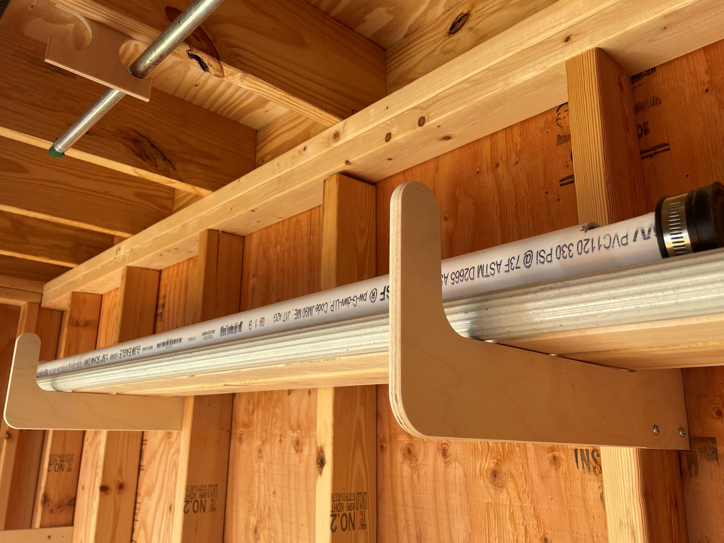 HangThis Up shed organization kit with garden tools and storage hooks for outdoor yard and garden shed organization.