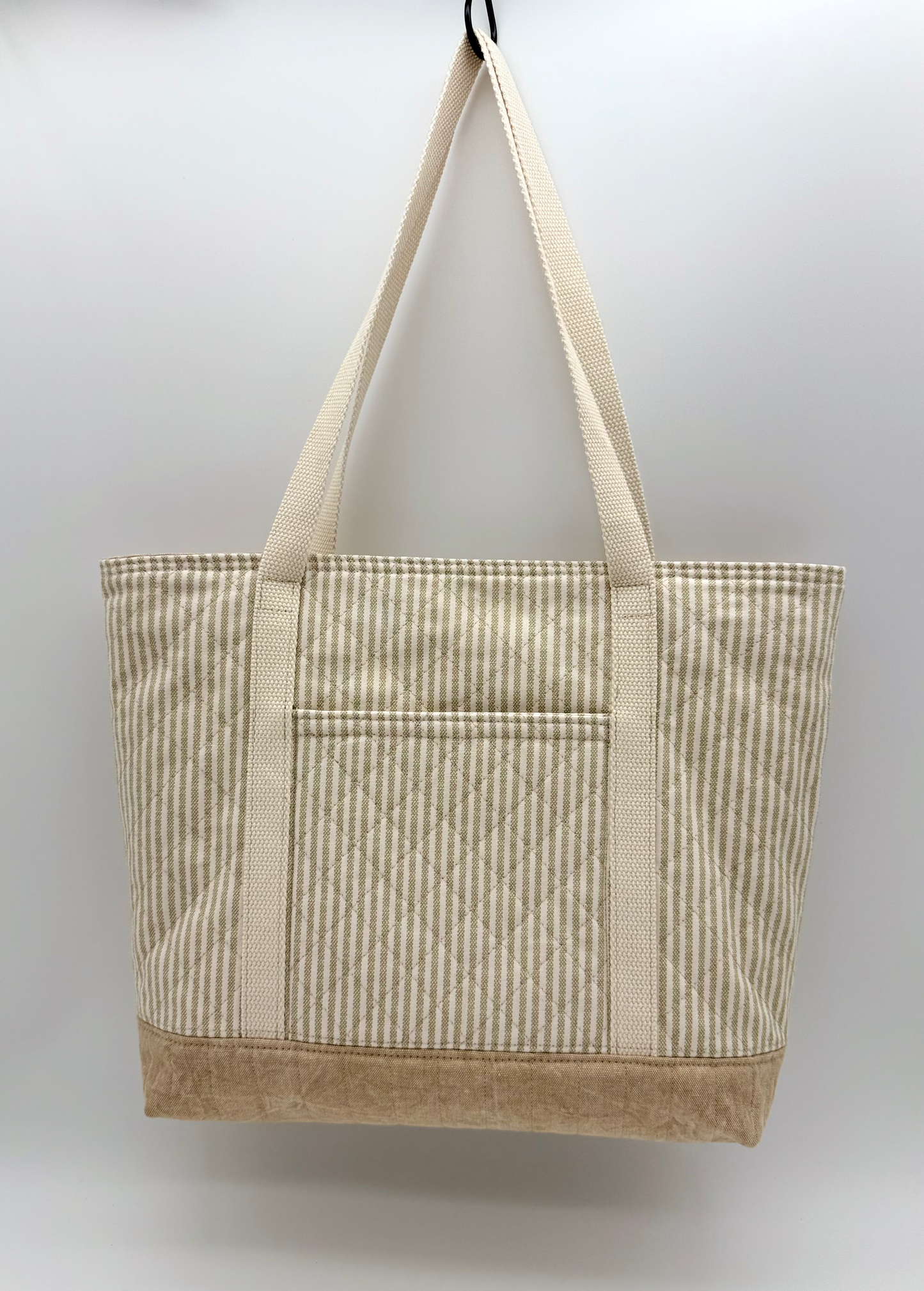 Back view of C2 Creations LLC taupe stripe quilted canvas tote bag with snap closure, showcasing its stylish handmade design.