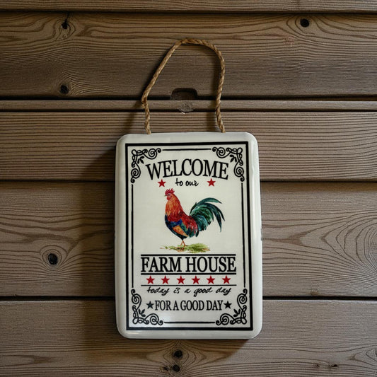 Rustic farmhouse welcome sign with a vintage metal rooster, decorative wall decor by Iron & Blossom.