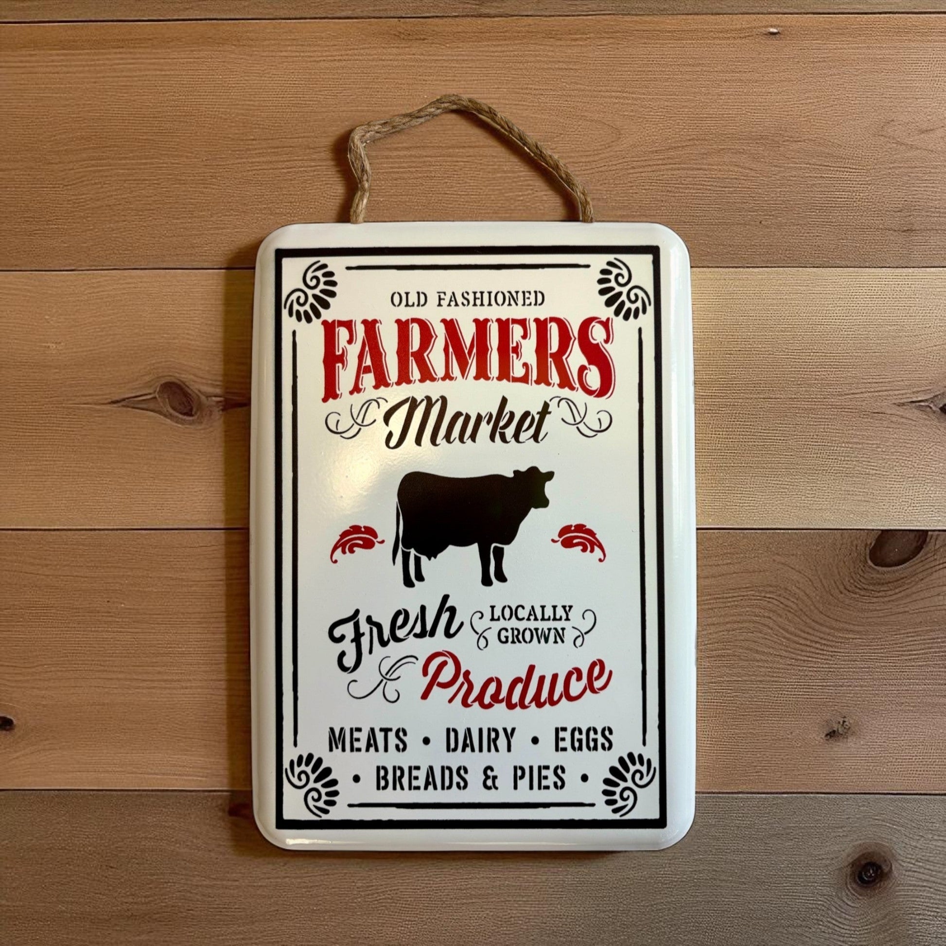 Vintage metal wall art sign with cow image, "Old Fashioned Farmers Market" lettering, by Iron & Blossom, rustic farmhouse decor.