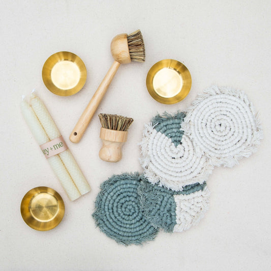 Set of four handmade macrame coasters by Tilley + Me, boho-style table decor with intricate knot patterns for protecting surfaces.