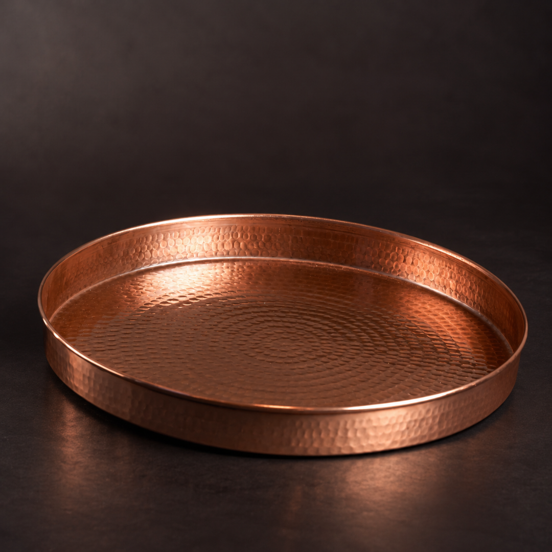 Copper oyster serving tray by Sertodo featuring a round design with engraved oyster shell patterns for elegant barware presentation.