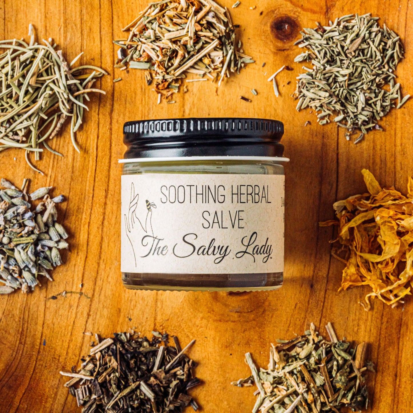 Soothing herbal salve in a 1 oz jar by The Salvy Lady, ideal for skin relief in bath and body care routines.