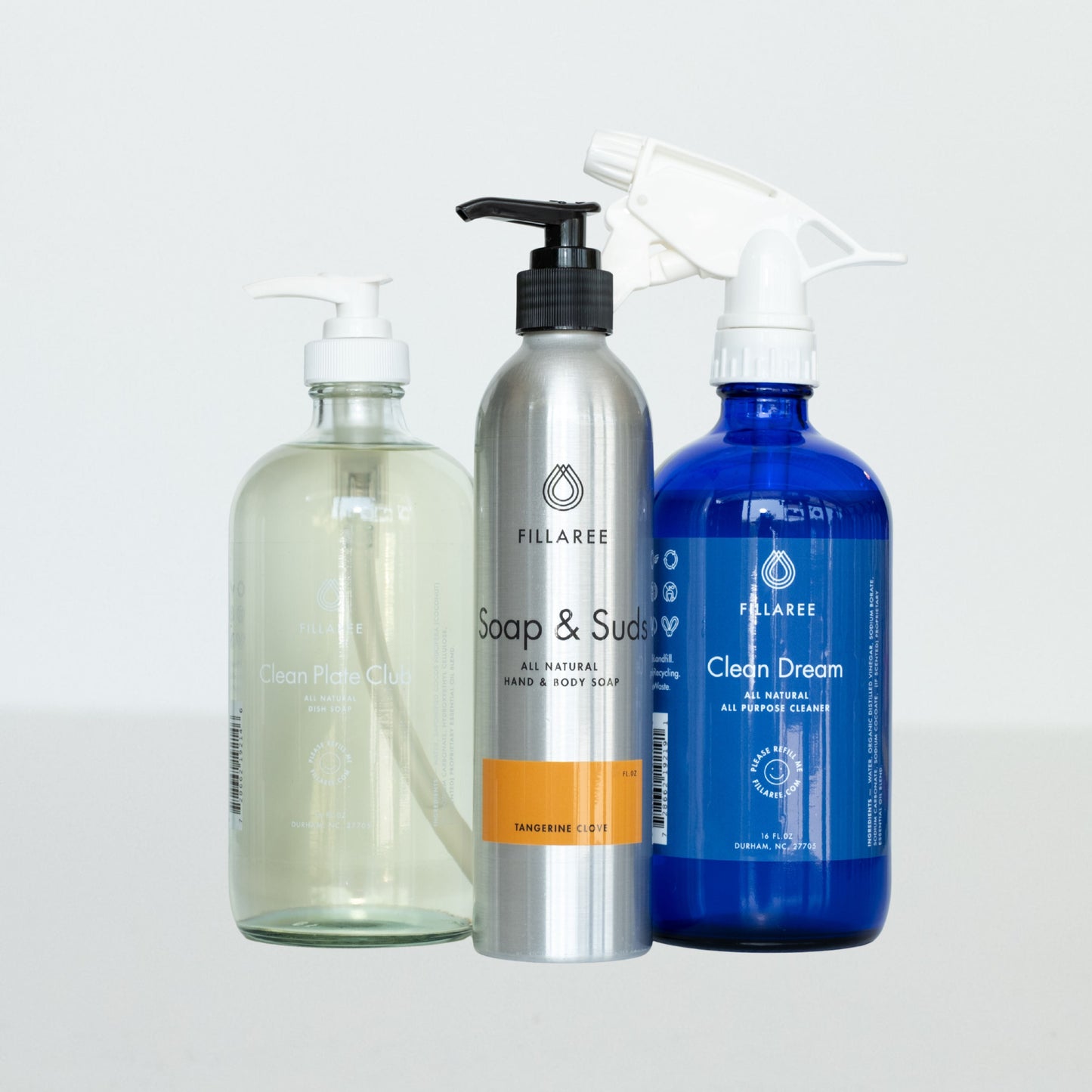 Fillaree Refillable Trio with orange and clove-scented cleaning products in bottles, designed for eco-friendly home cleaning.