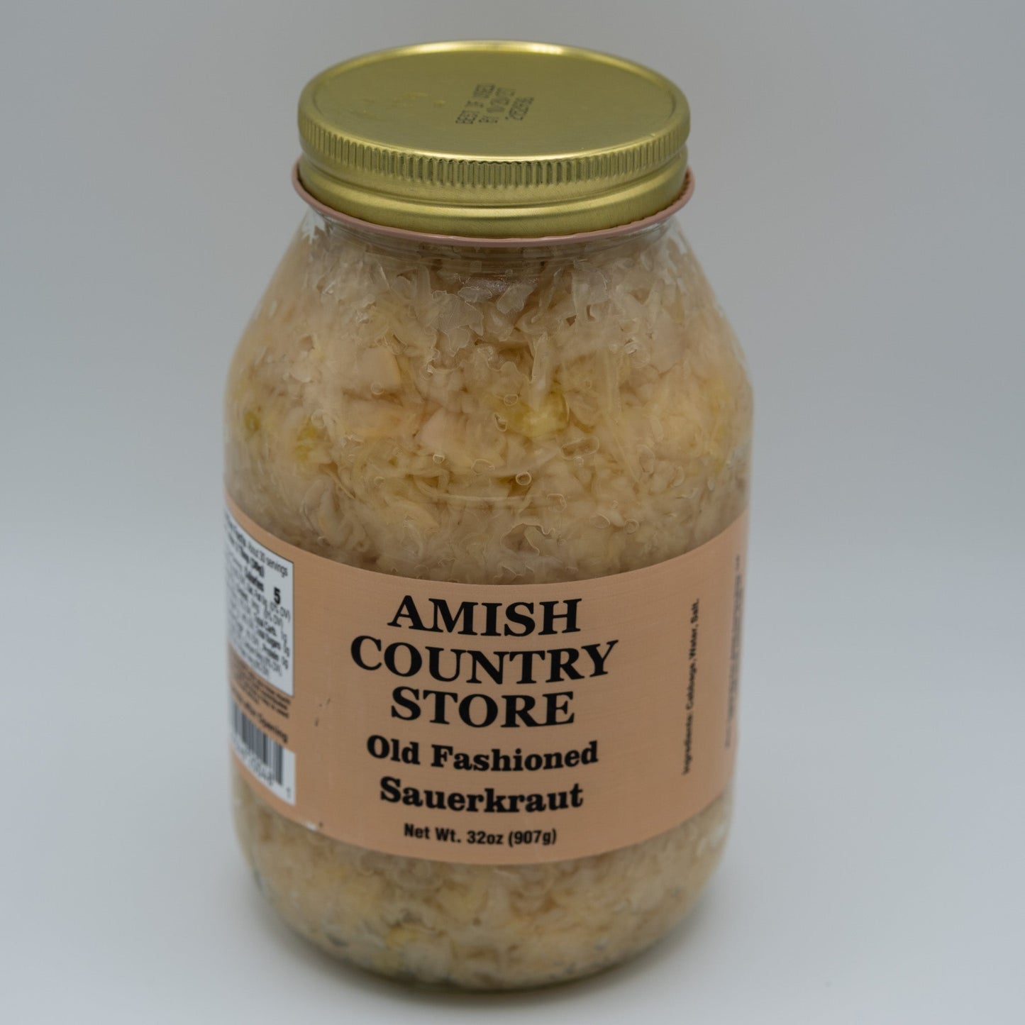 Canned Amish Country Store Old Fashioned Sauerkraut 32oz jar with white label and metal lid, showcasing traditional fermented cabbage.