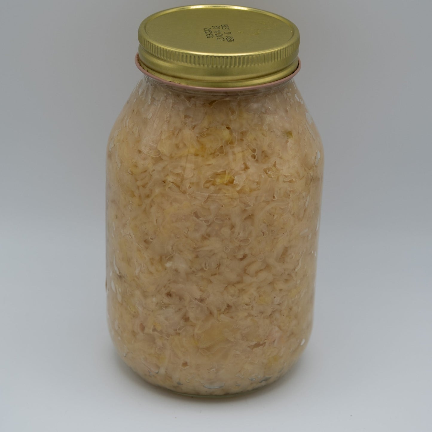 Canned Amish Country Store Old Fashioned Sauerkraut jar, 32oz, with traditional fermented cabbage in a clear glass container.
