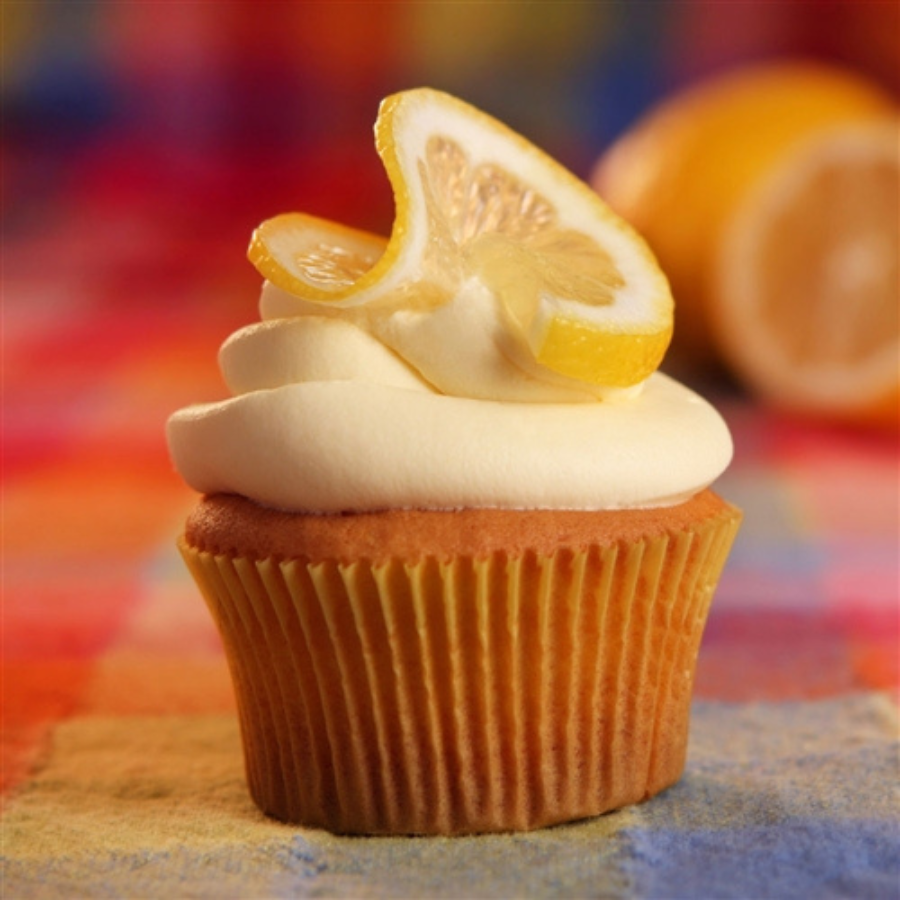 Gluten-free lemon cupcake mix by Heartland Gourmet, 16 oz, with fresh lemon and batter ready for baking.