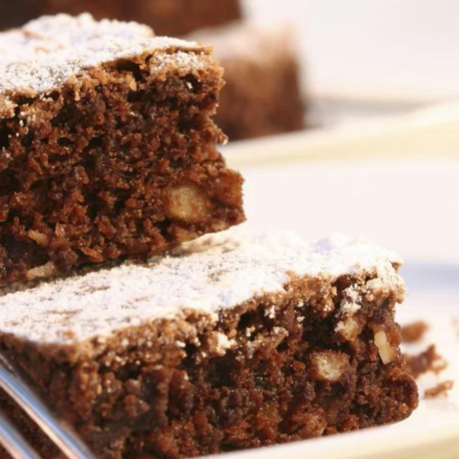 Gluten-free chocolate brownie mix by Heartland Gourmet in a 19.68 oz package, displayed in a food product image.