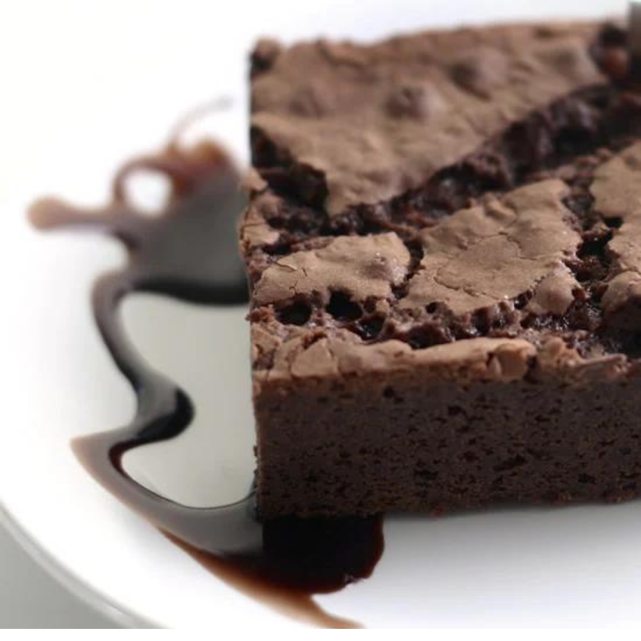 Gluten-free chocolate brownie mix from Heartland Gourmet, 19.68 oz, with a close-up of the prepared brownie batter in a baking dish.