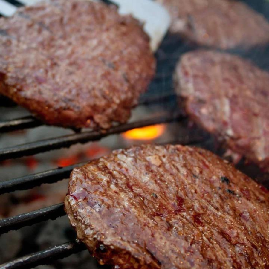 Four pre-formed Nebraska bison burger patties from BuyNebraska.com, 1/3 lb each, ready for grilling or cooking.