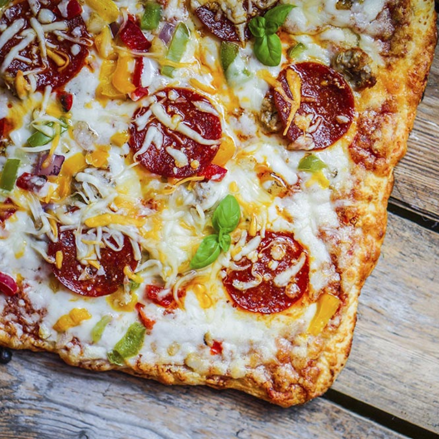 Organic oregano and basil pizza crust mix in a 15 oz package by Heartland Gourmet, perfect for homemade pizza.