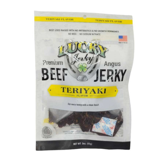 Thin slices of Teriyaki Beef Jerky from Nebraska Star Beef, displayed in a 3 oz package on a rustic wooden surface.