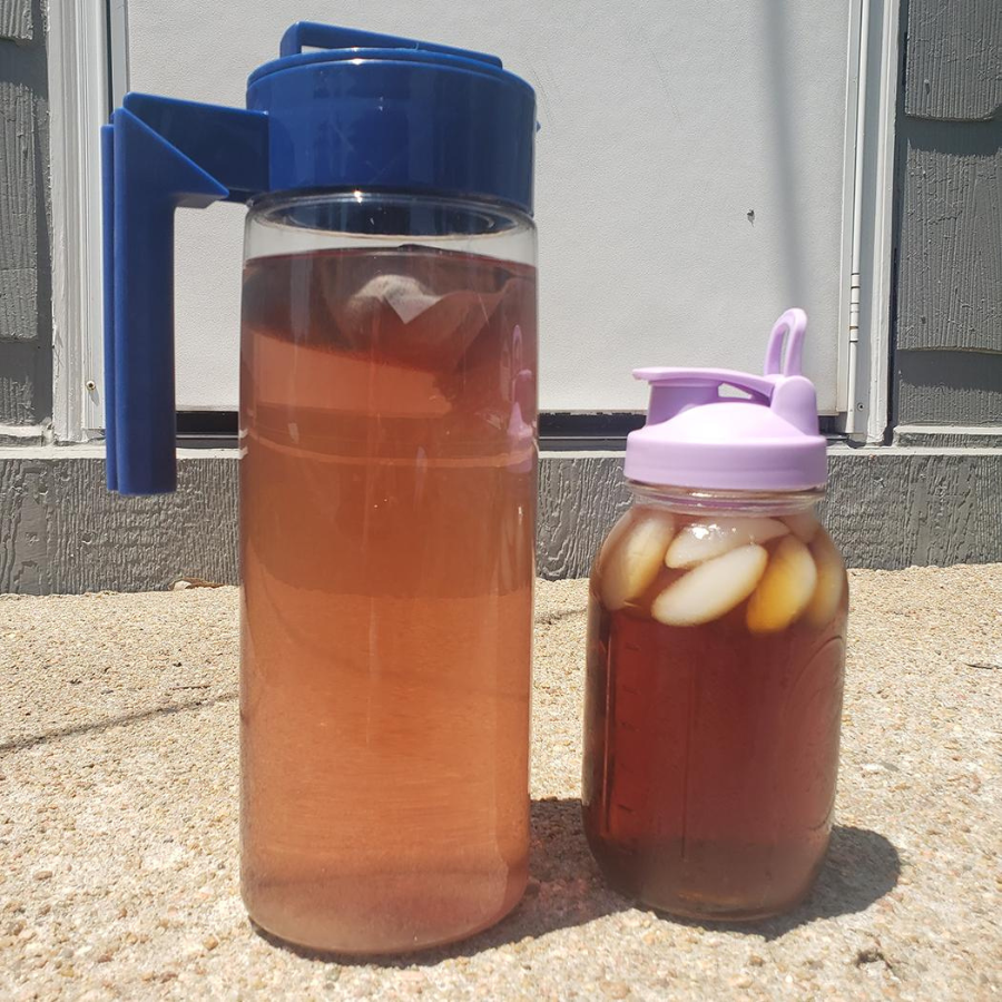 Cold brew black strawberry tea in pitcher, caffeinated beverage with two tea bags from BuyNebraska.com, refreshing tea drink