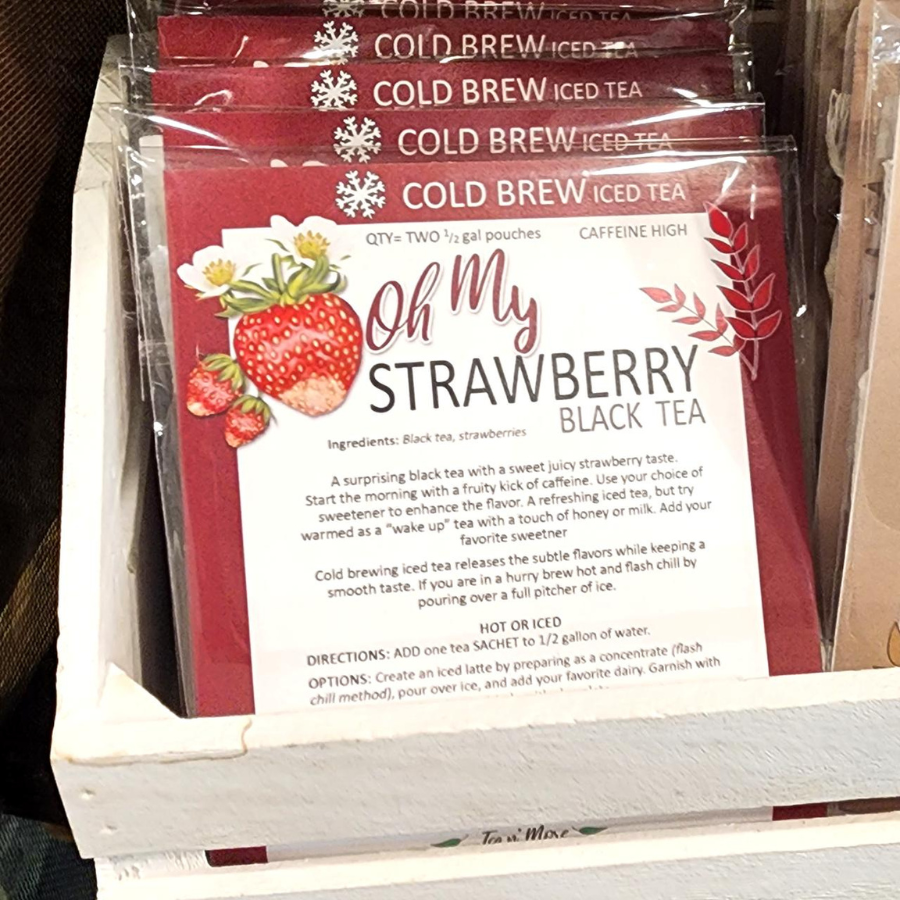Cold brew black strawberry tea in pitcher with two tea bags, caffeinated beverage from BuyNebraska.com.