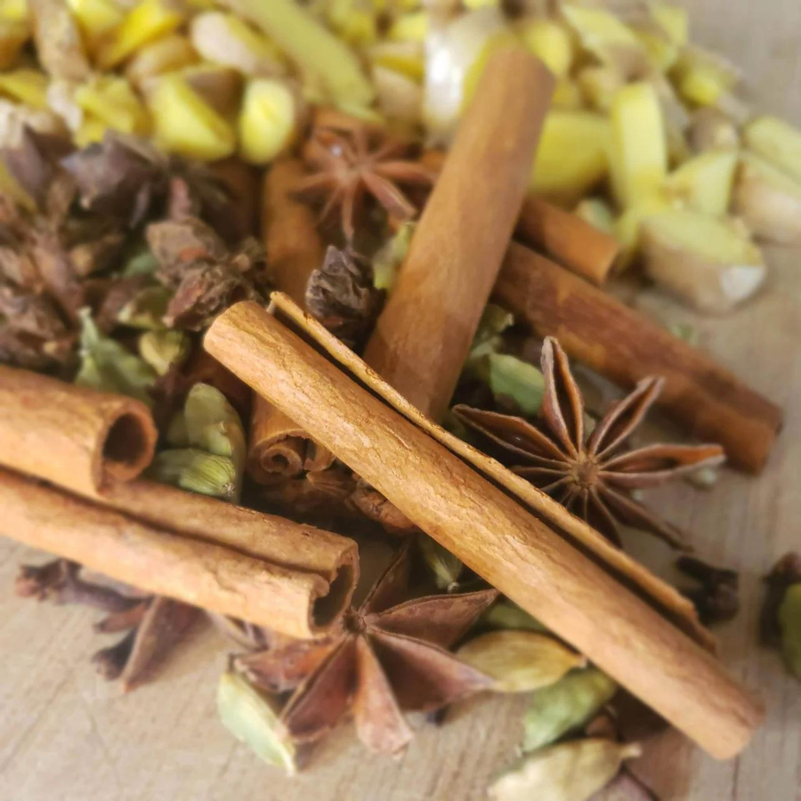 Two DIY chai tea kits from Tea n More, featuring spice blends and ingredients in colorful packaging.