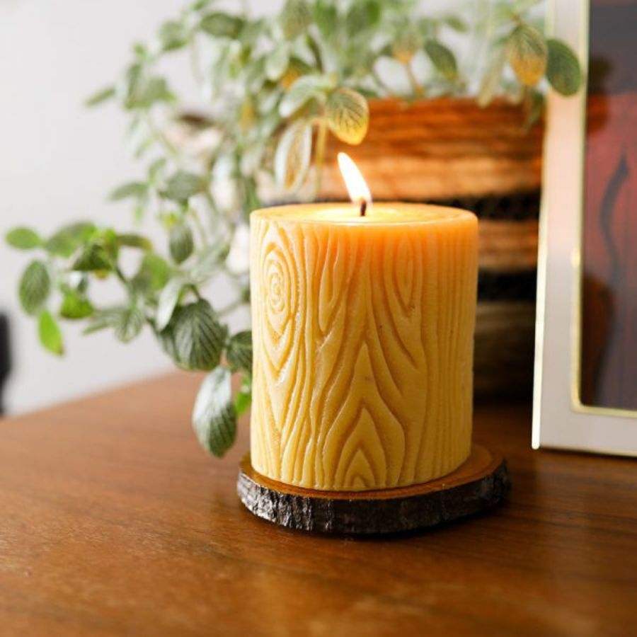 Beeswax candle with wooden base, 12 oz, from Buzz Savories, LLC, suitable for home decor and ambient lighting.