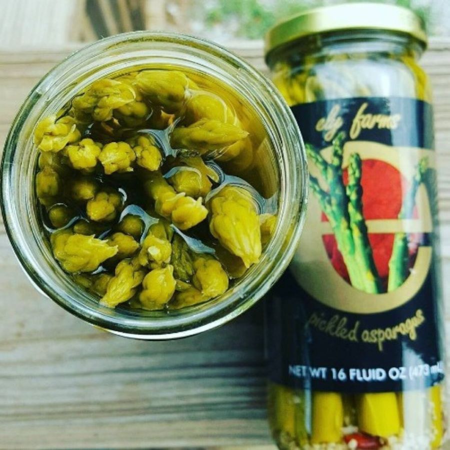 Jar of Ely Farms pickled asparagus in a 16 oz glass container, showcasing vibrant green spears ready to enjoy.