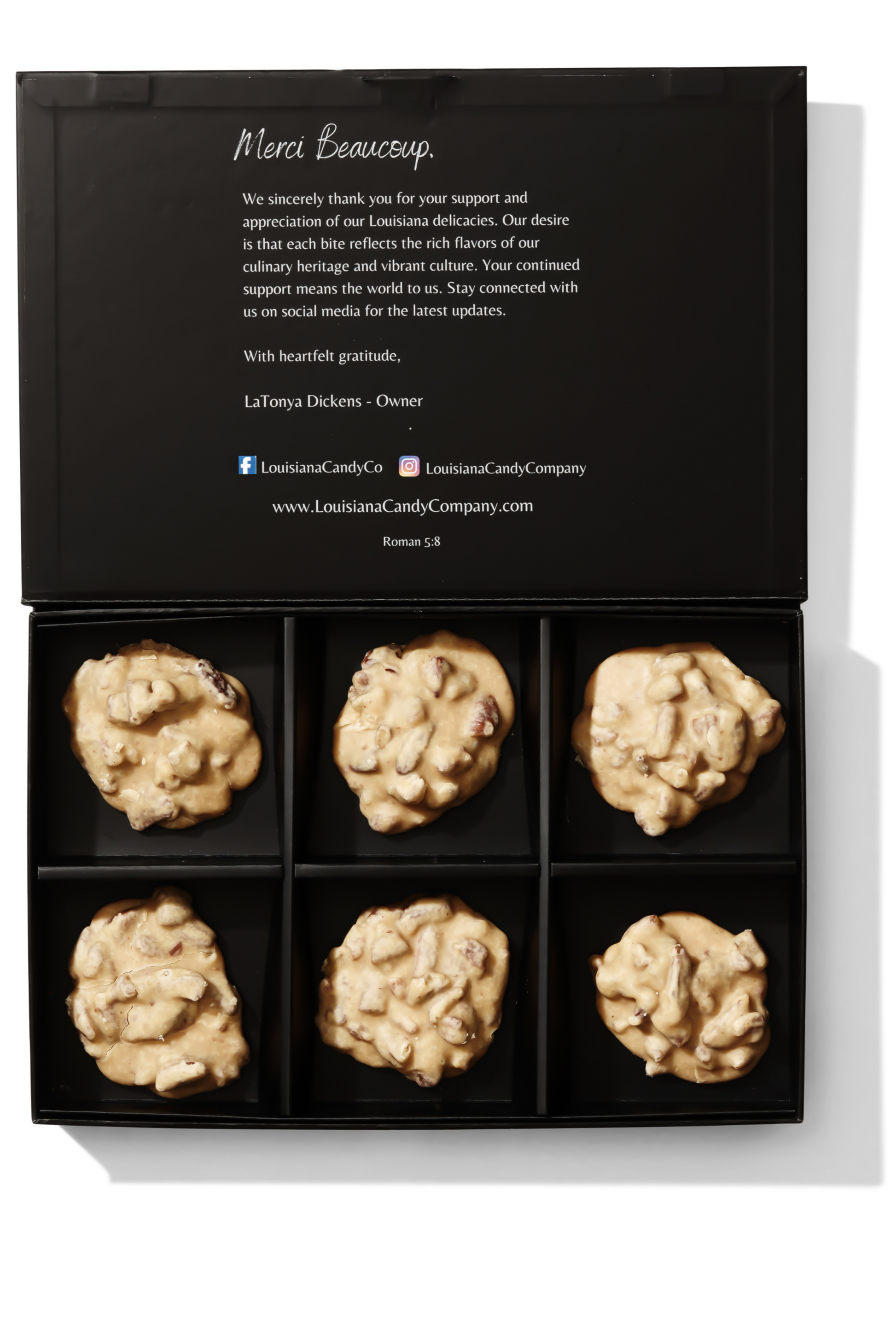 Six classic pecan pralines from Louisiana Candy Company, glossy caramel-coated pecans on a white background.