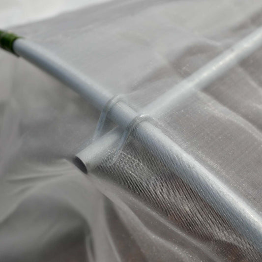 Close-up of Bootstrap Farmer heavy-duty insect netting on a low tunnel for protection against pests and insects.