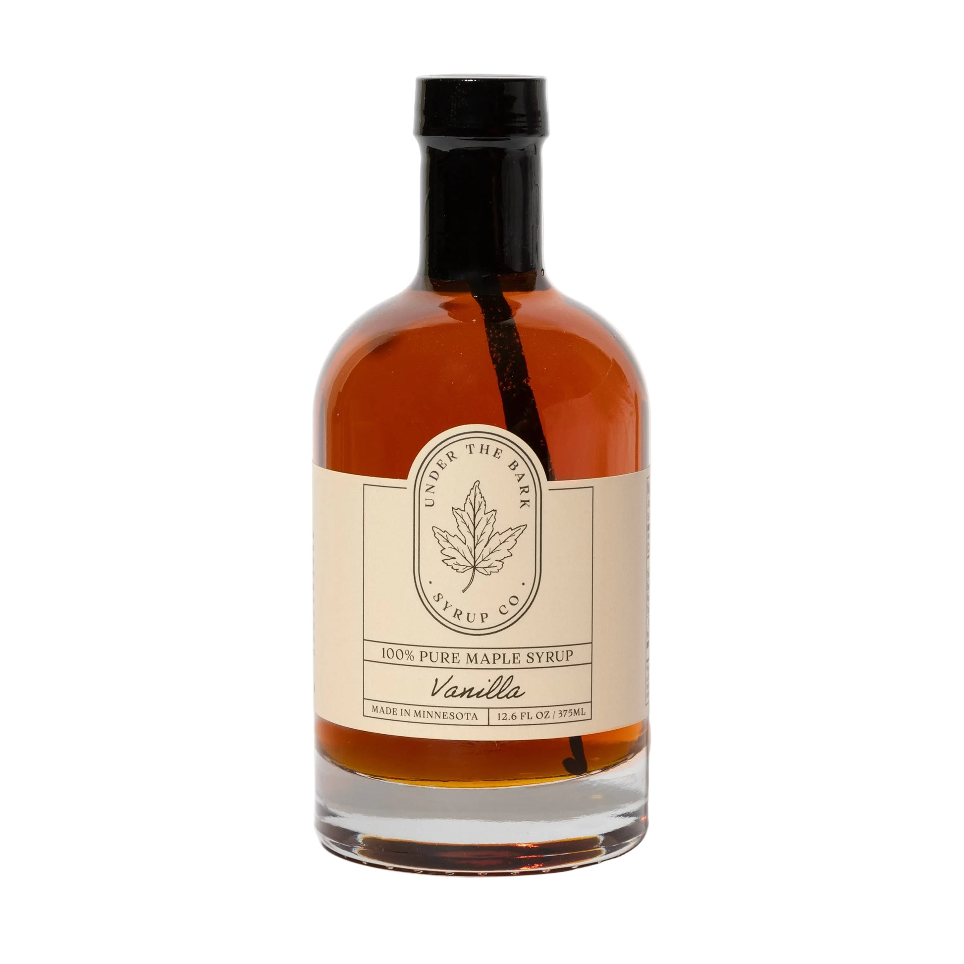 12oz bottle of Vanilla Maple Syrup by Under The Bark Syrup Co, showcasing clear glass with rich vanilla and maple syrup inside.